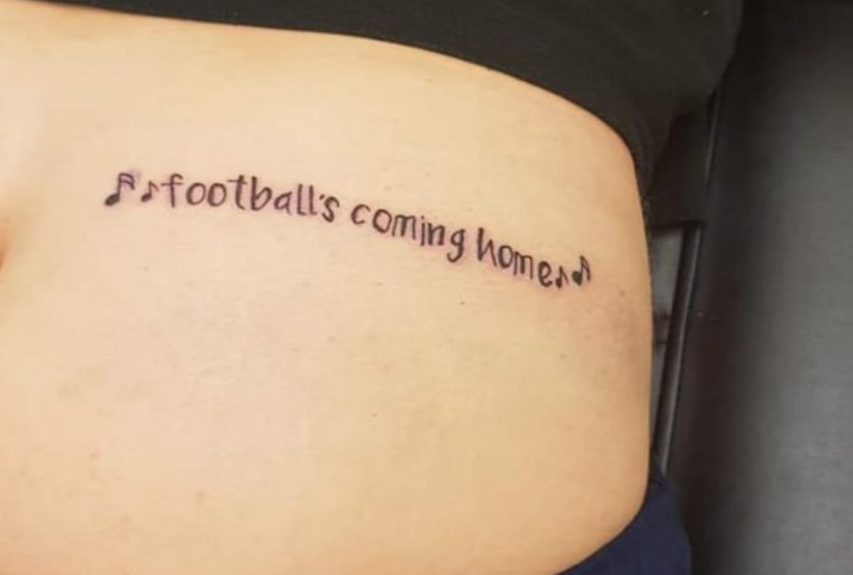 Football Fan man tattooed onto his bum in russia