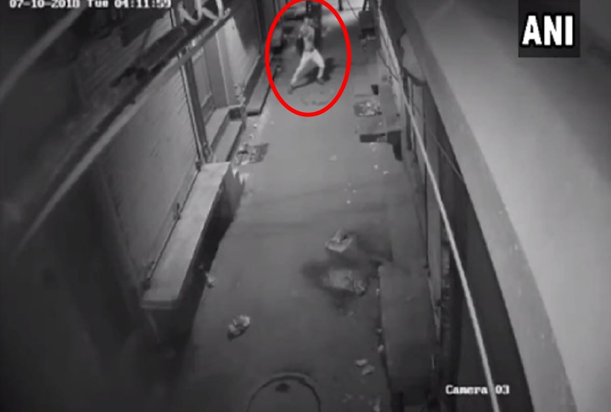 CCTV footage of a thief dancing before he break into a shop