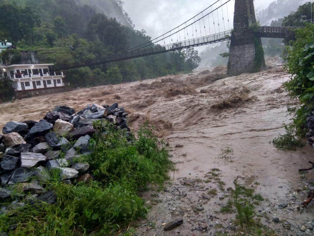 uttarakhand weather update bridge flows in flood and dehradun many people death due to rain