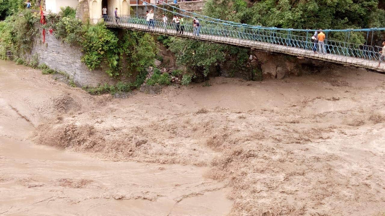 uttarakhand weather update bridge flows in flood and dehradun many people death due to rain