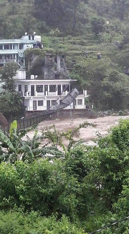 uttarakhand weather update bridge flows in flood and dehradun many people death due to rain