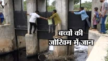 locals risk lives cross canal through collapsed bridge 2 months ago in kheda Gujarat