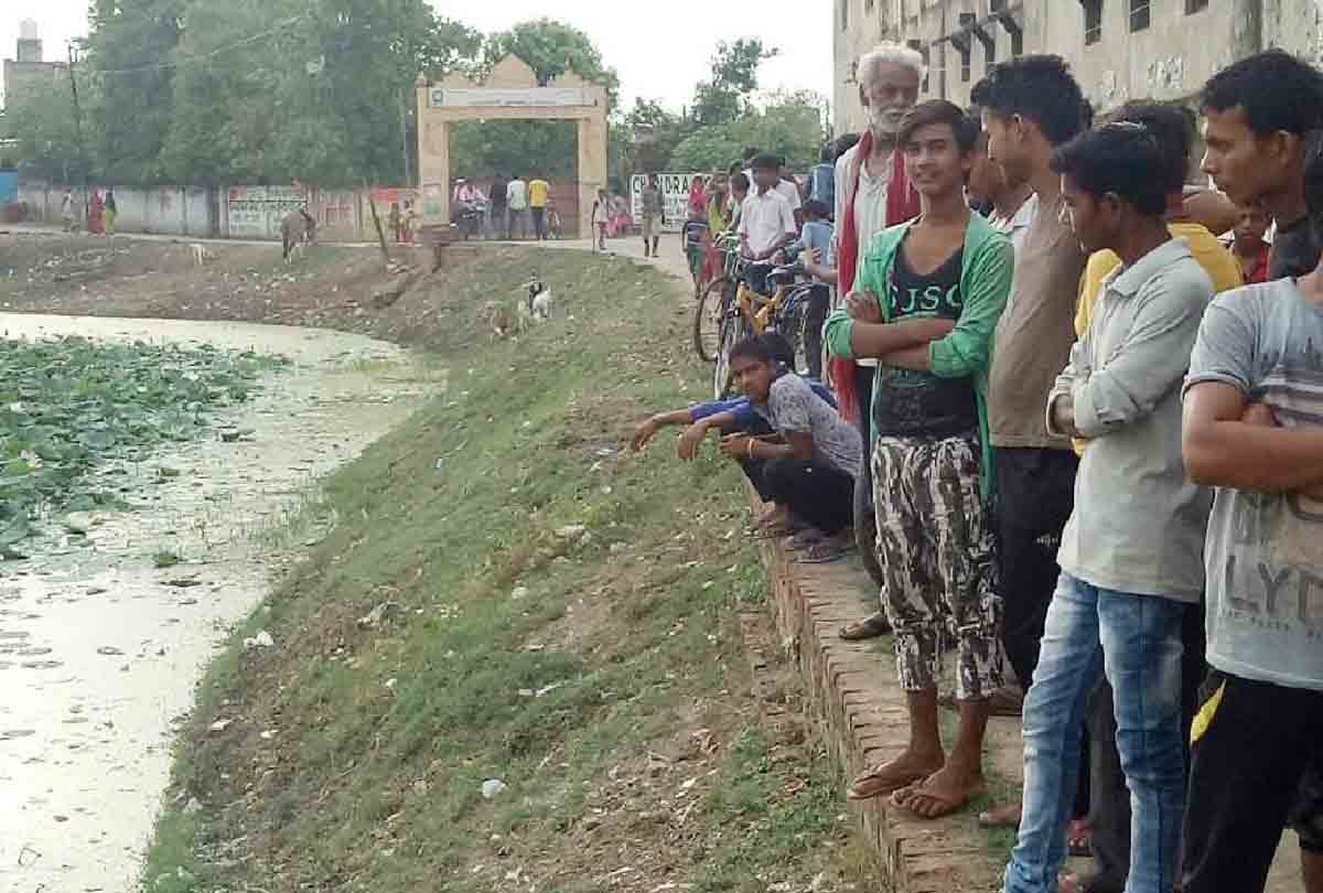dead body of a newborn girl Found  in pond