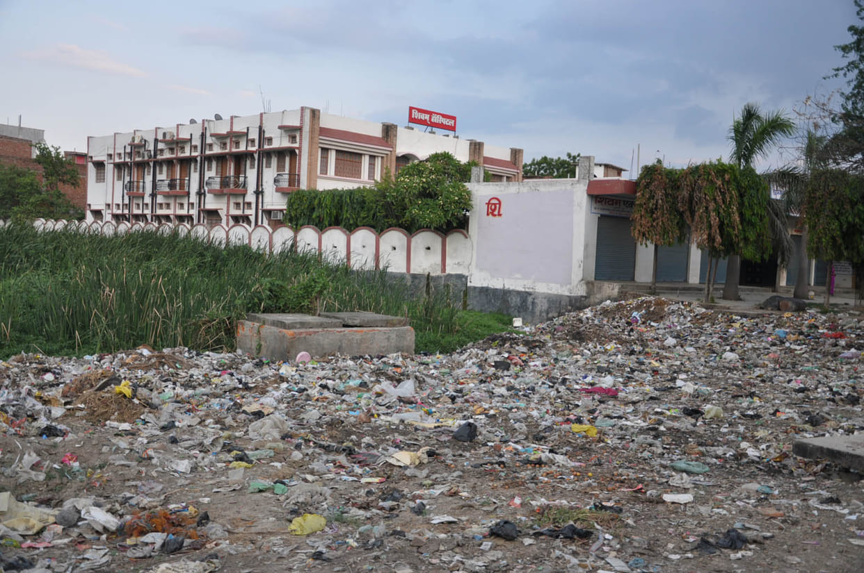 Garbage dump being dumped in the green belt