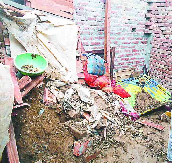 House roof collapses, mother-son dies
