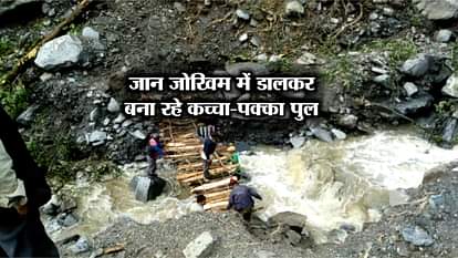 VILLAGERS CONSTRUCTING A WOODEN BRIDGE IN CHAMOLI GARHWAL 
