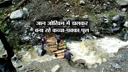 VILLAGERS CONSTRUCTING A WOODEN BRIDGE IN CHAMOLI GARHWAL 