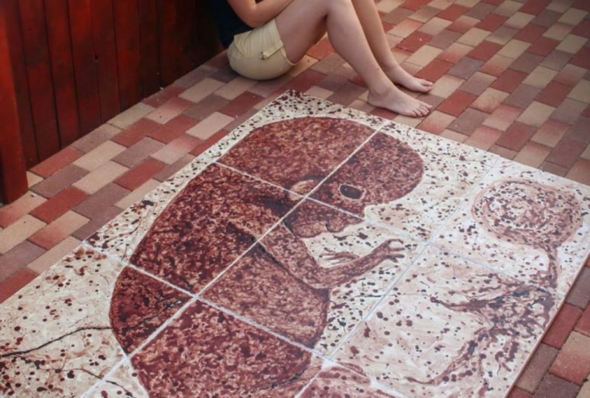 Women made a painting with the blood of her period