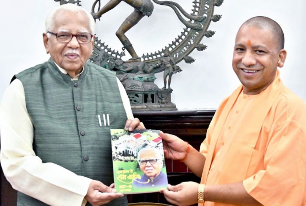 yogi adityanath congratulates governor ram naik for completing four years.
