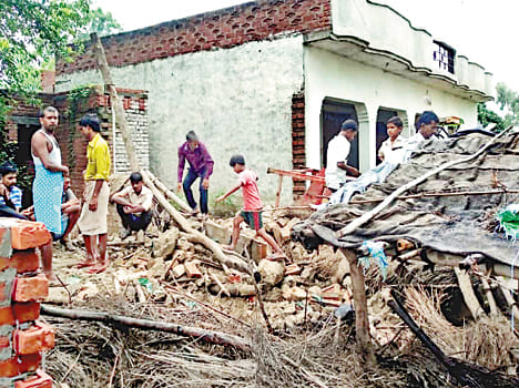 wall fell in rain, old lady died