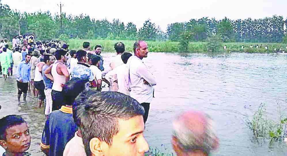 Uncle and nephew immersed in  Krishna river