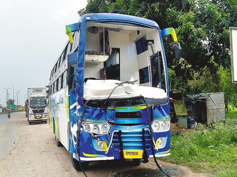 Bus collides with truck, injures 11
