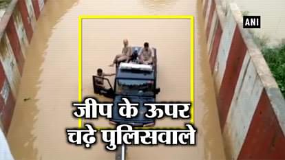 KANPUR POLICE WATERLOGGED HELPED OUT BY CRANE FROM FLOODED RAILWAY UNDERPASS