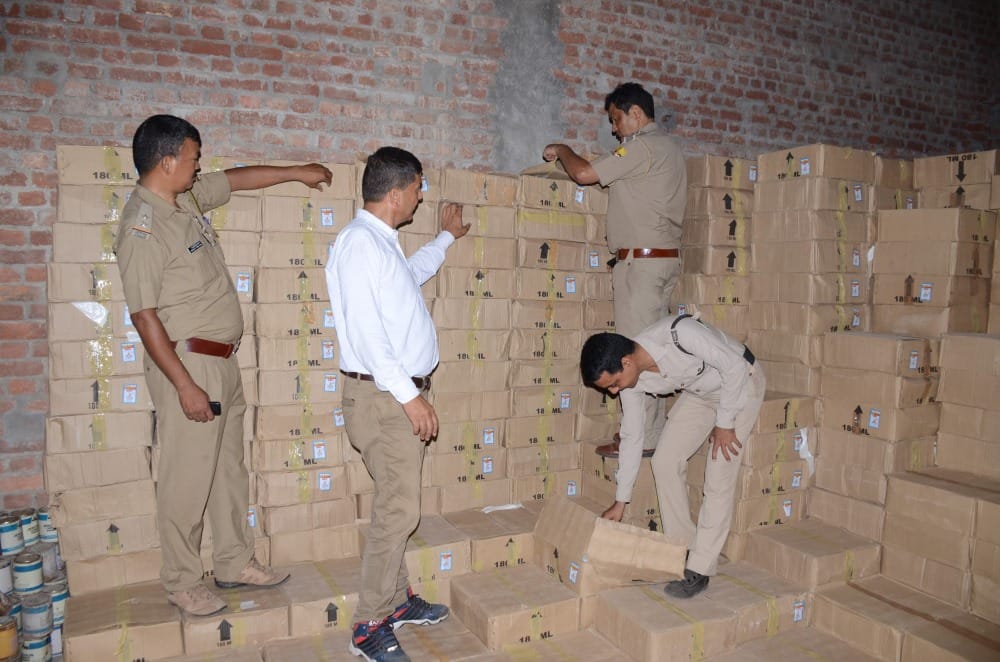 huge number of alcohol bottle in sanitary warehouse cost is two and half crore