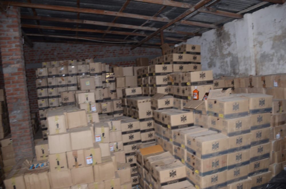 huge number of alcohol bottle in sanitary warehouse cost is two and half crore