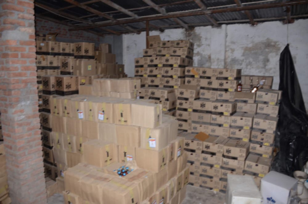 huge number of alcohol bottle in sanitary warehouse cost is two and half crore