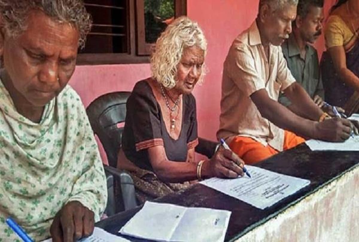 96 year old woman sitting in literacy examination in kerala