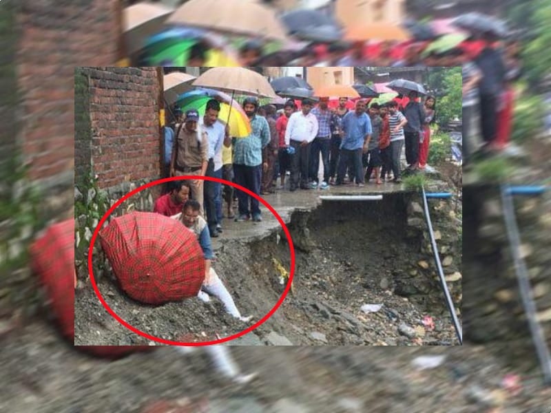bjp mla ganesh fell into Pit during visit of rain affected area