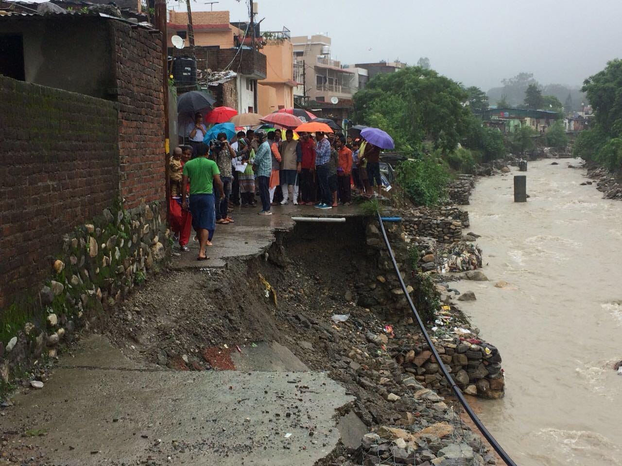 bjp mla ganesh fell into Pit during visit of rain affected area