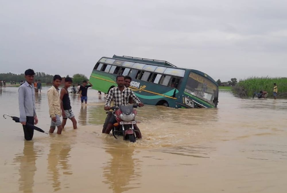  A bus falls in flood water in balrampur.