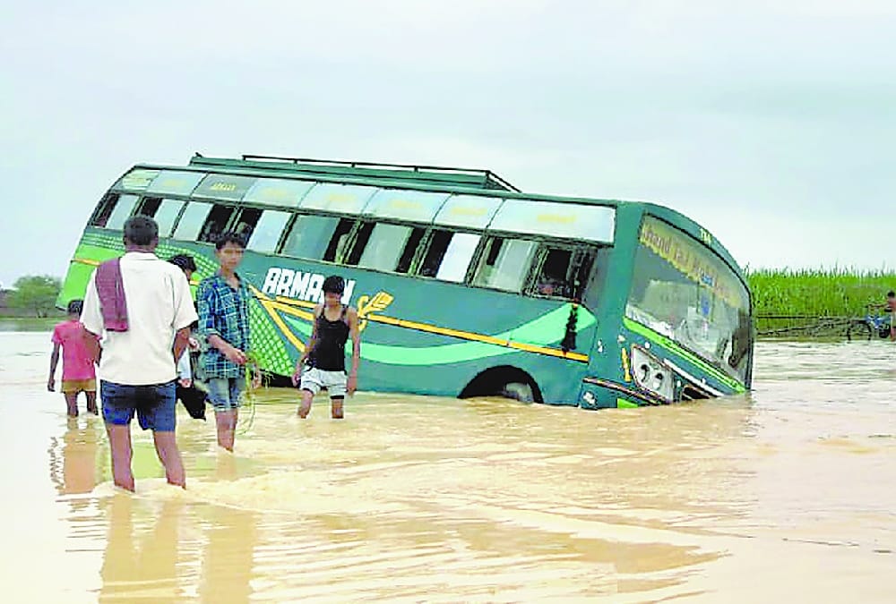  A bus falls in flood water in balrampur.