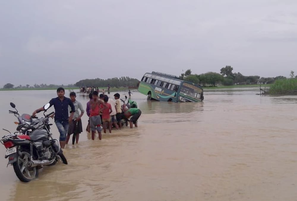  A bus falls in flood water in balrampur.