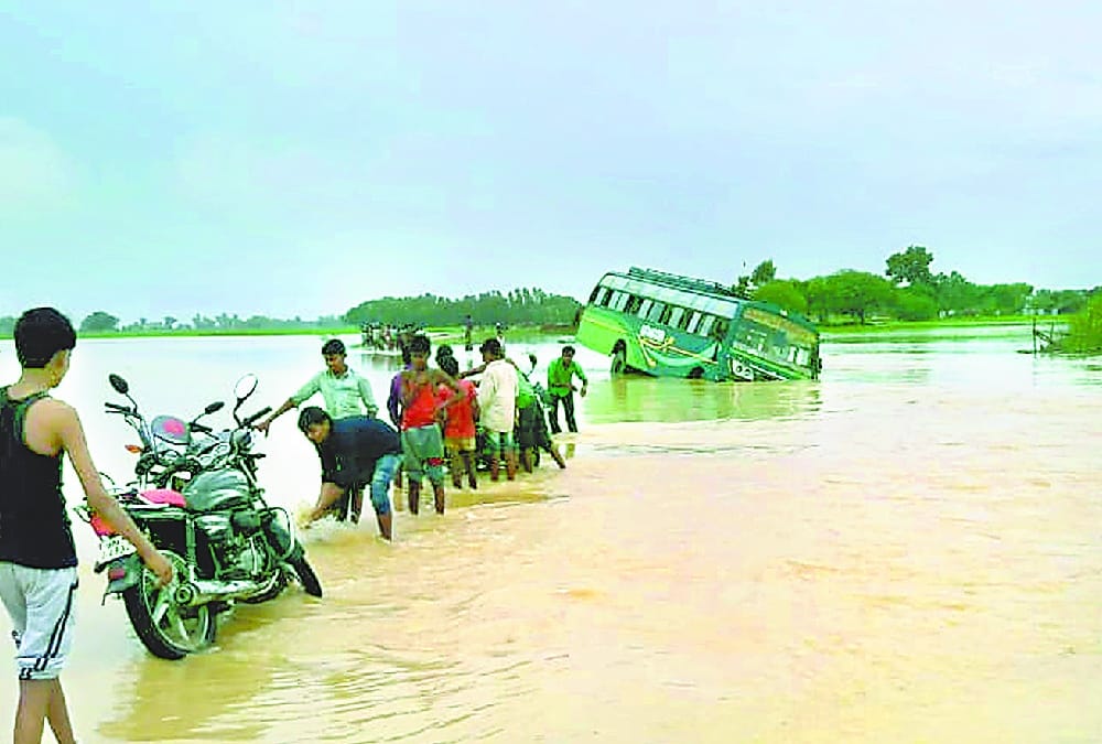 A bus falls in flood water in balrampur.