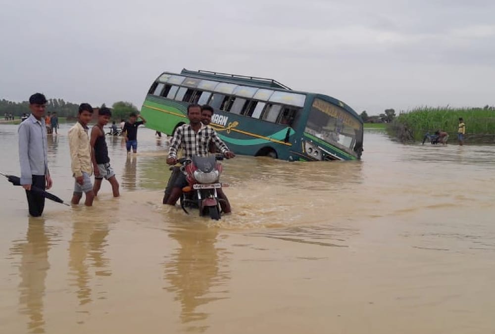  A bus falls in flood water in balrampur.