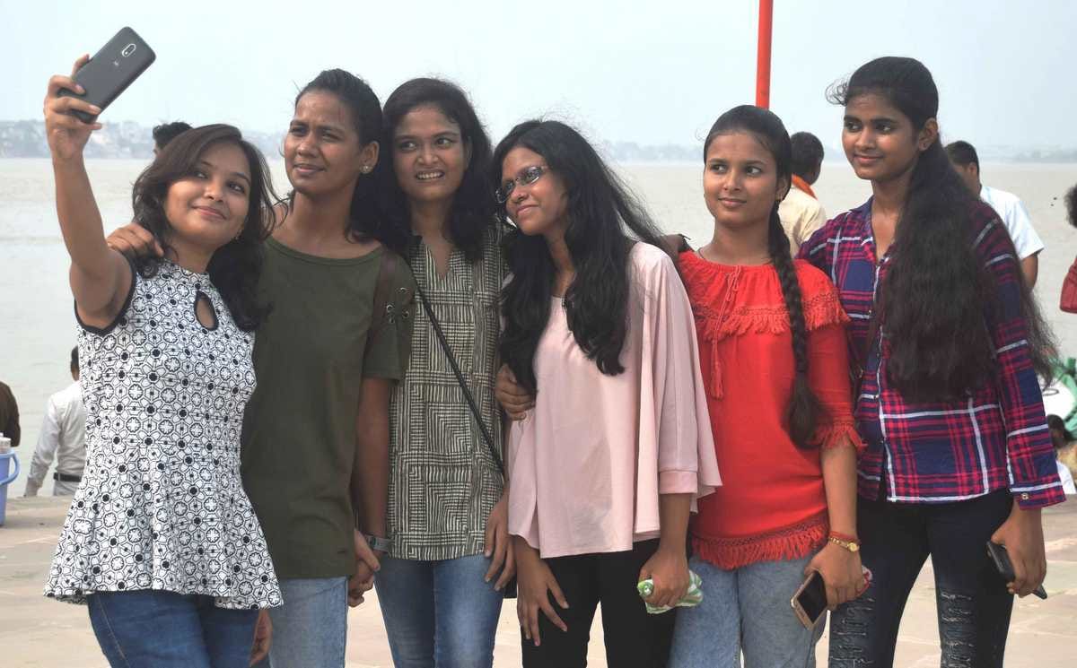 varanasi people enjoy on ganga ghat after clean weather