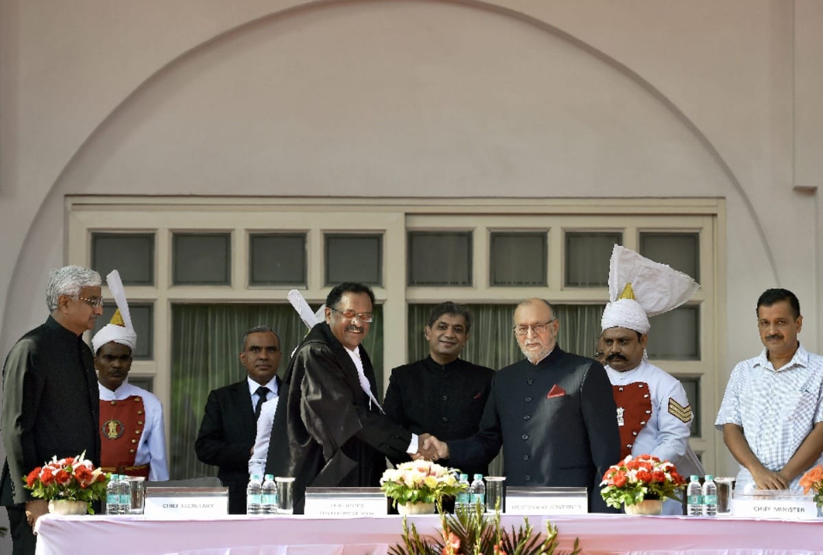 photos of delhi high court chief justice menon oath in ceremony when lg kejriwal shares light moment