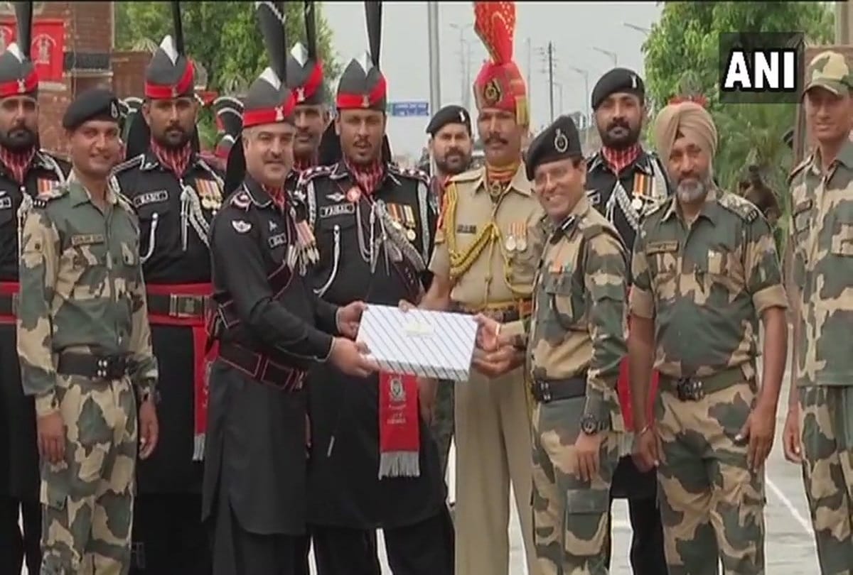 India & Pakistan border guards exchange sweets at Attari-Wagah border 