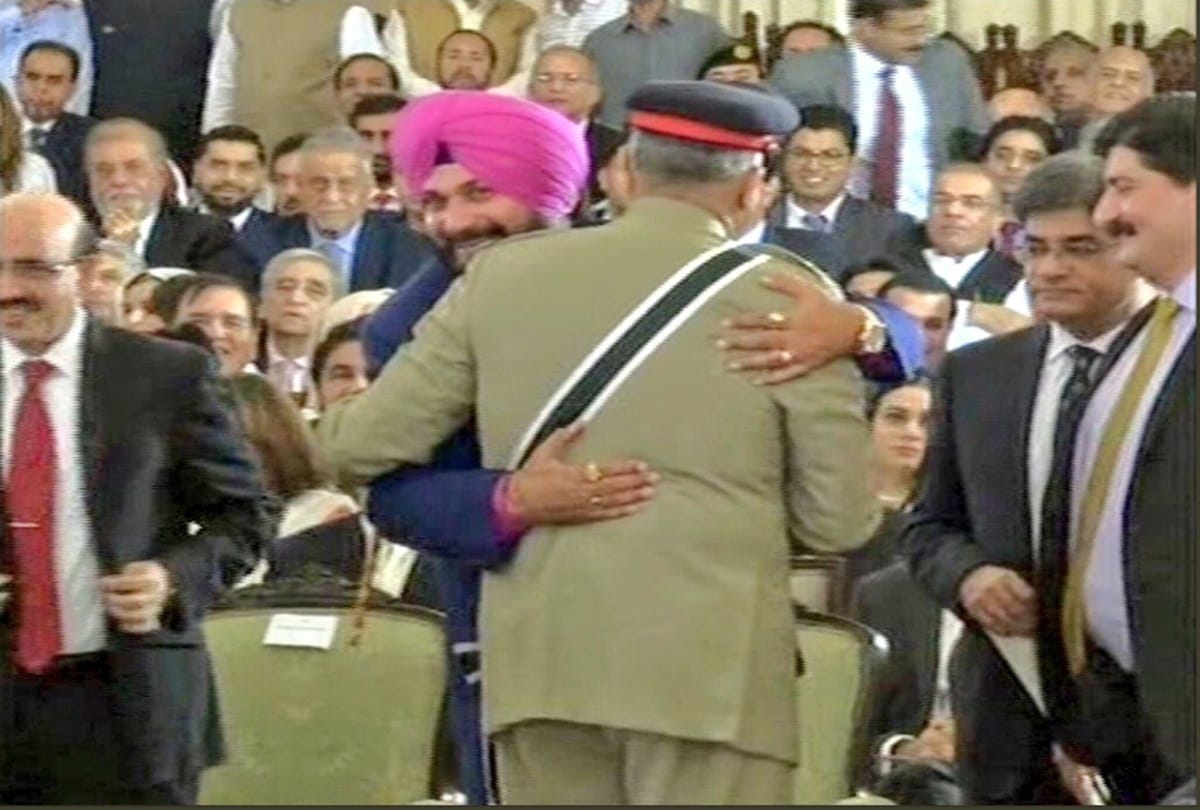 navjot singh siddhu was hugging pakistan army chief when their amy was attacking on loc