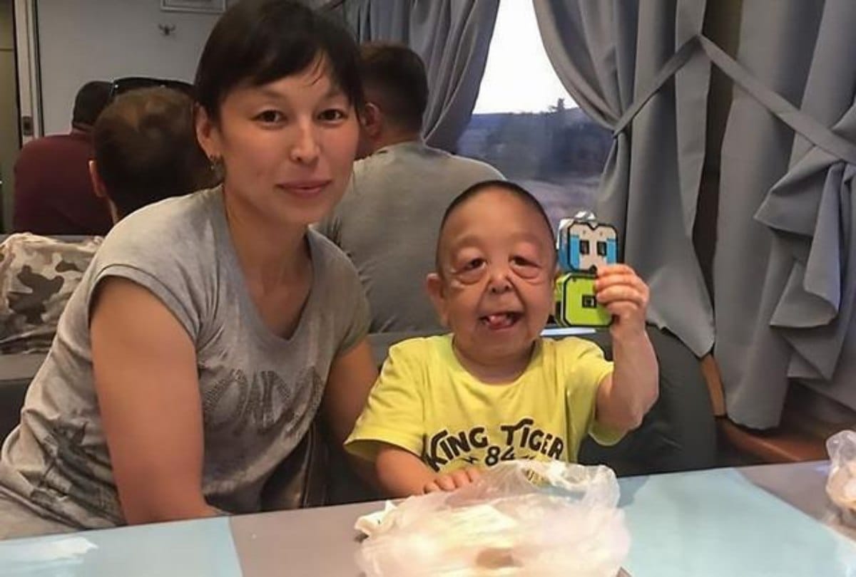 In the age of six only the boy looks like wrinkled pensioner
