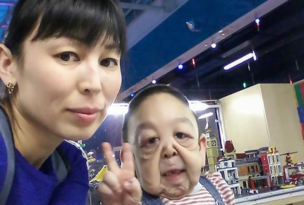 In the age of six only the boy looks like wrinkled pensioner