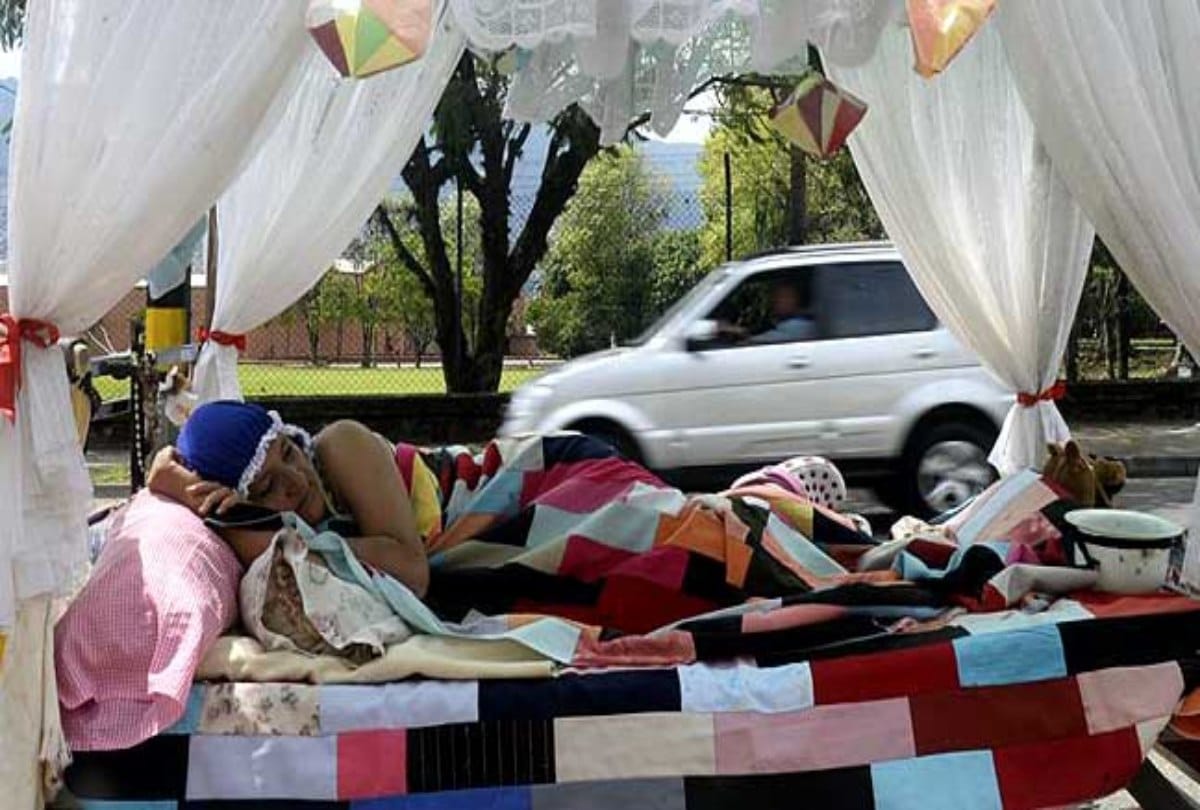 Lazy people sleeps on the road on world day of laziness at Colombia