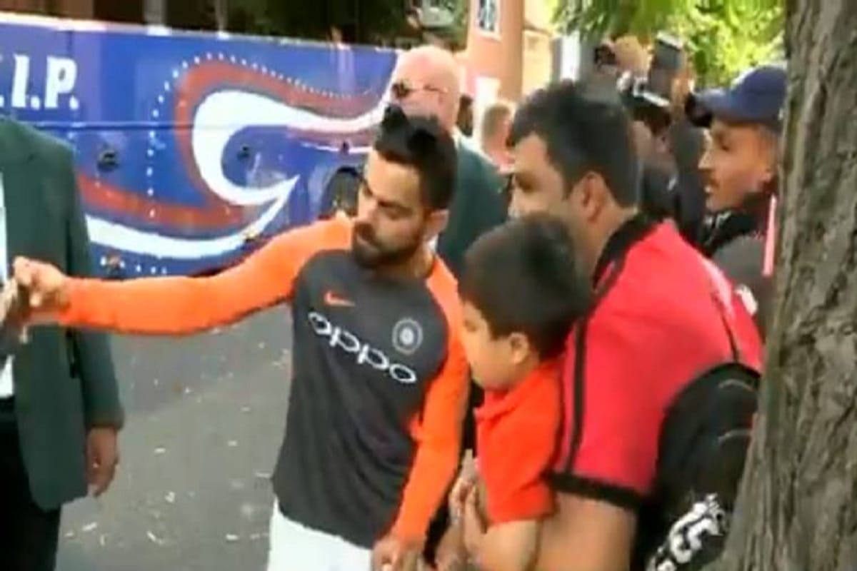 Virat Kohli gets a selfie with a little fan after win against england