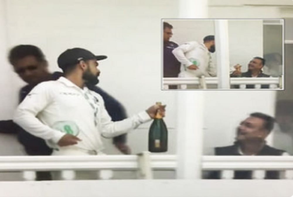 virat Kohli gifts his Man of the Match champagne bottle to ravi Shastri