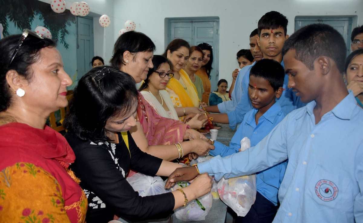 Sisters gift helmet her brothers on raksha bandhan