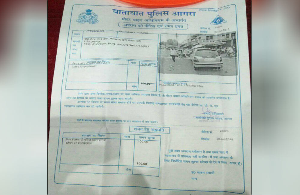 car owner fined for not wearing helmet while driving in agra