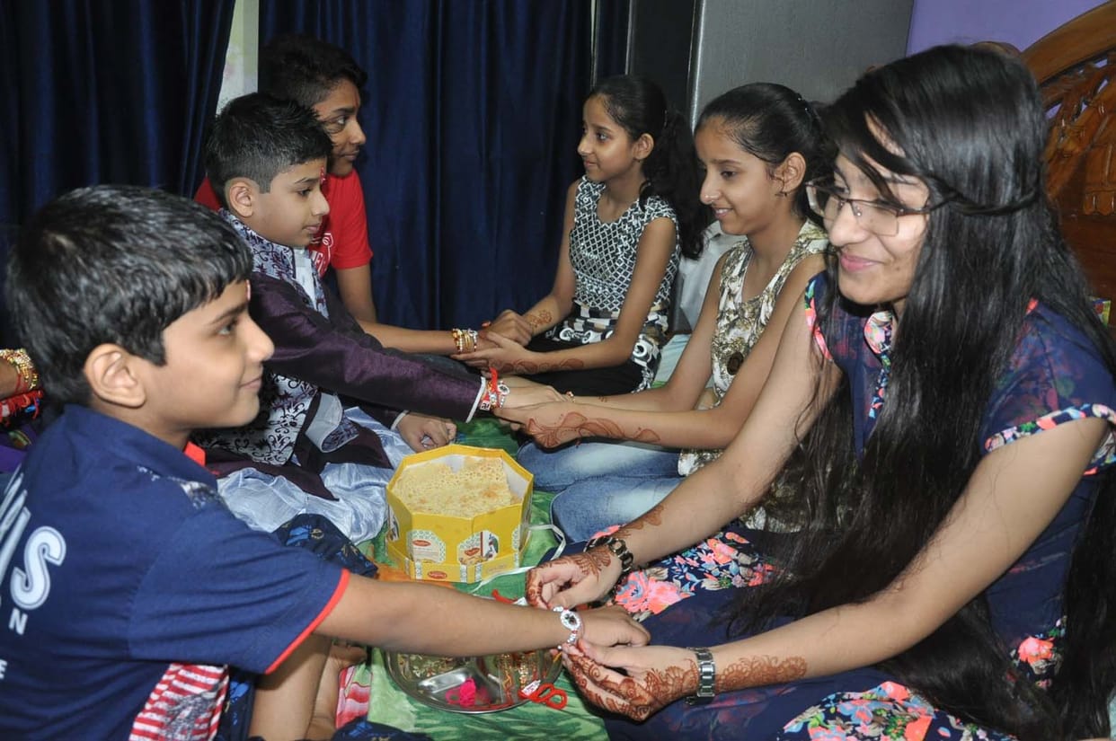 Brothers Bandhin Rakian on wrists