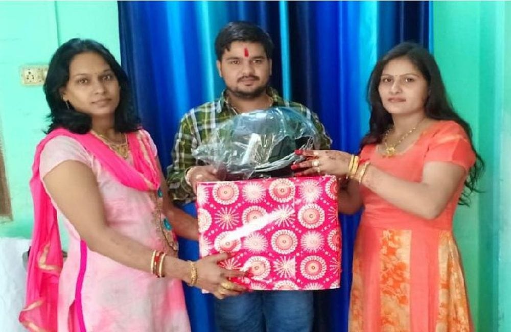 rakshabandhan celebration with helmets gifts in mathura