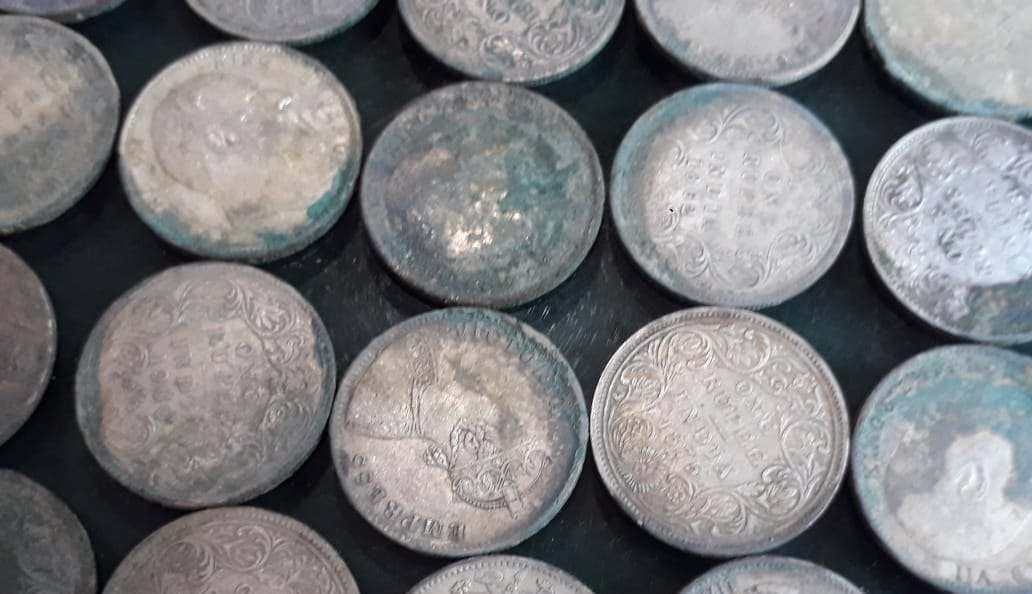 Silver coins found during digging grave