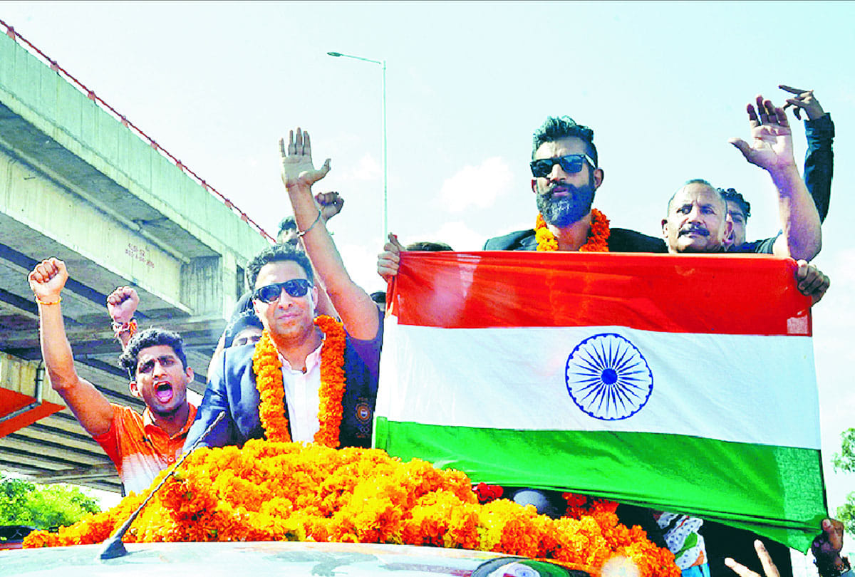 asian games bronze winner in wushu surya bhanu pratap welcomed at jammu by people