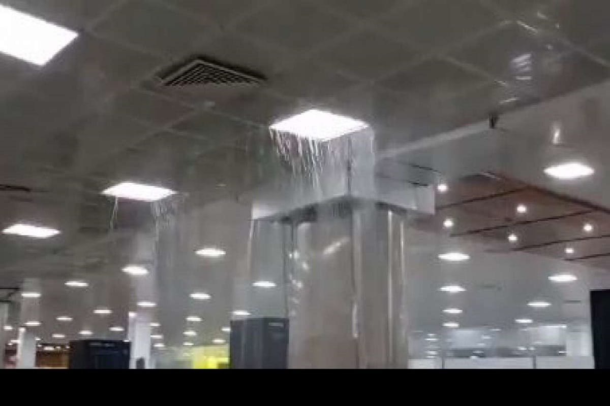 Rain water filled in the passenger waiting room of Guwahati Airport