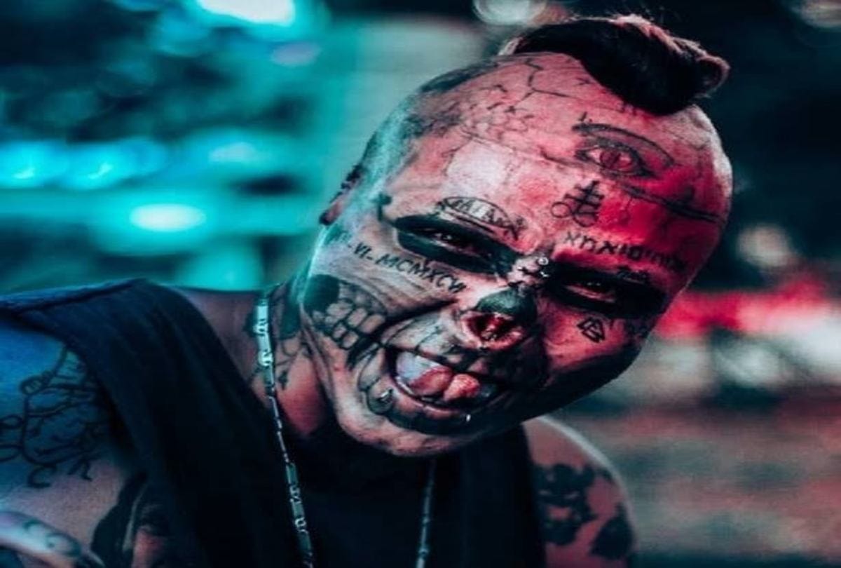Body modification man cut his ears and half nose to look like skull