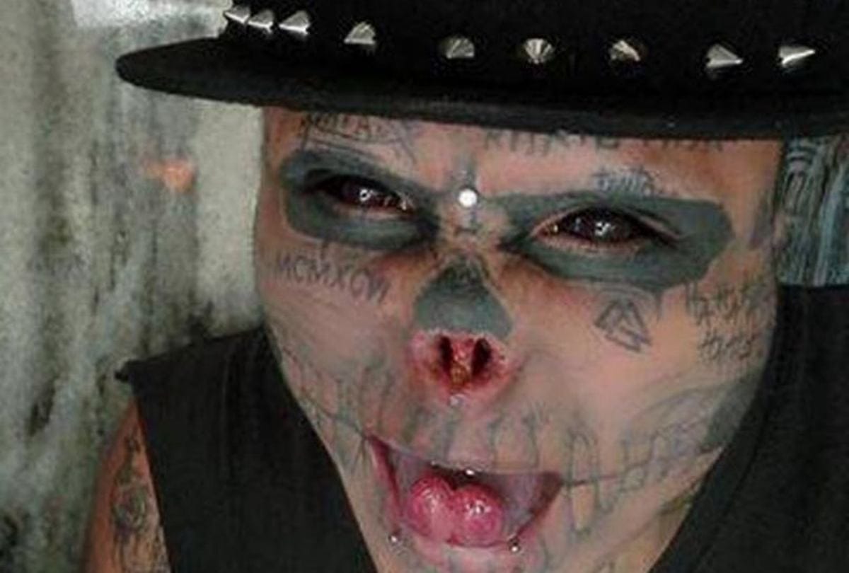 Body modification man cut his ears and half nose to look like skull