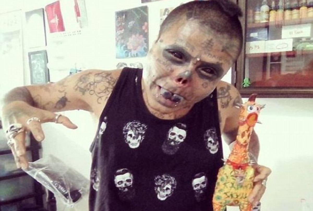 Body modification man cut his ears and half nose to look like skull