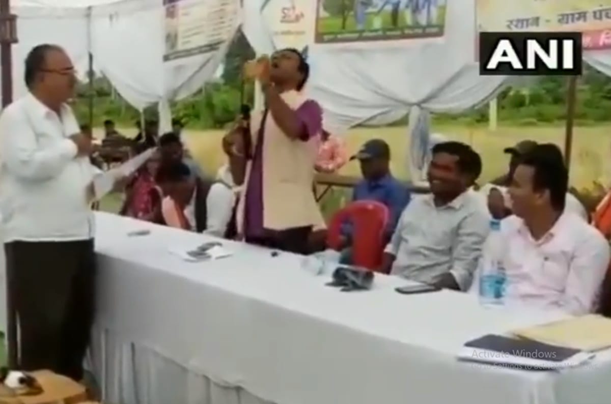 Video: Congress MLA Deepak Baij drinks contaminated water and makes an officer drink too