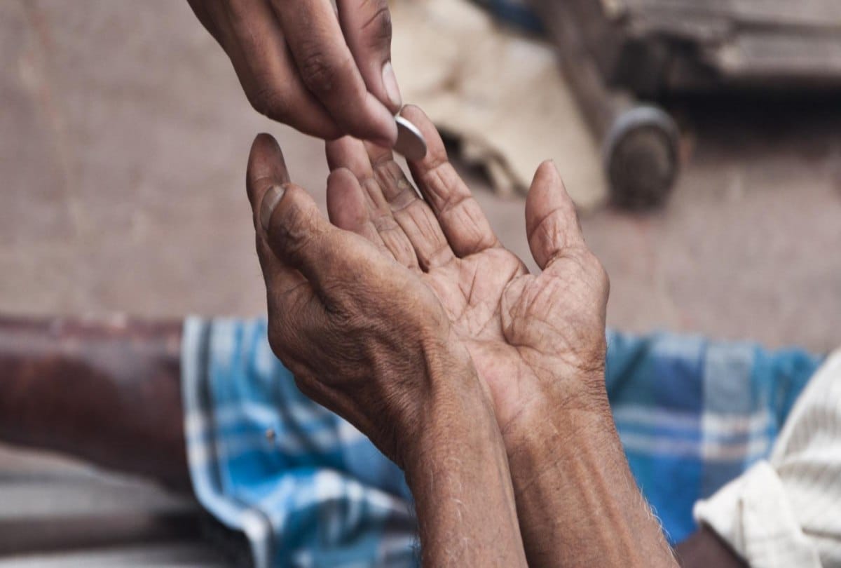 A Beggar donate small amount to flood victims in Kerala