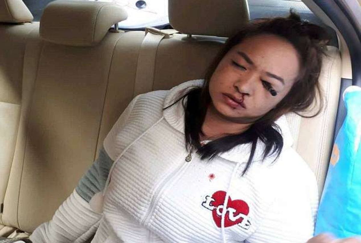 eyebrow pencil stuck in women eyes while doing makeup in moving car in bangkok